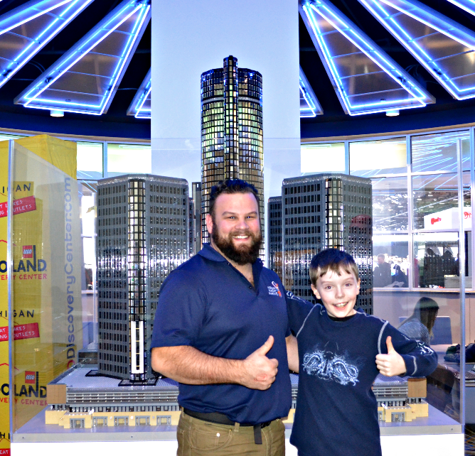 Ten-year-old LEGO expert , Bryce B. posing with LEGOLAND Model Builder, Derek Chock.